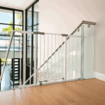 baby-safety-gate-mounted-to-glass-balustrade