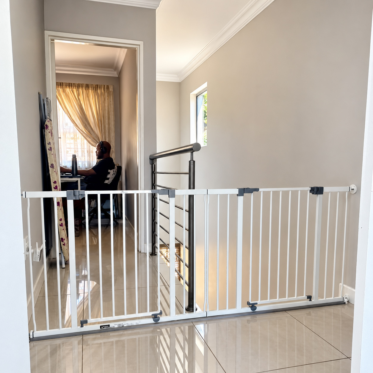Connecting-two-baby-gates-to-form-one-long-gate-with-two-openings